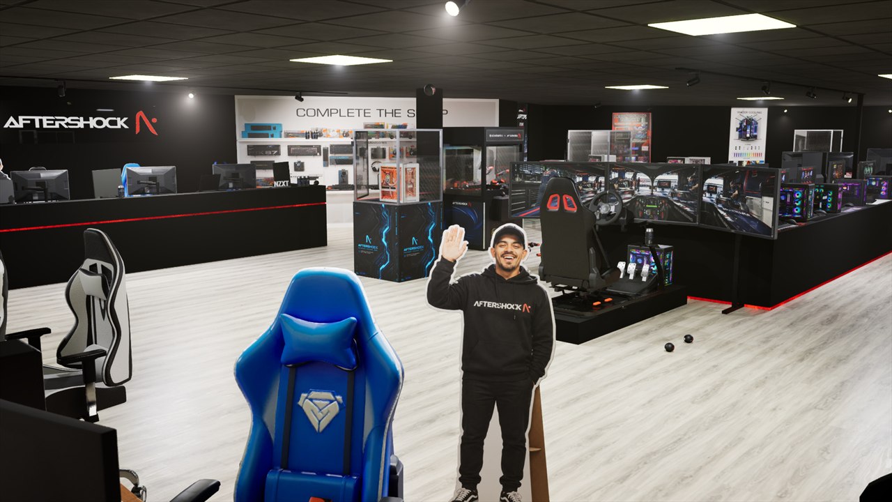 Wide view of the Aftershock virtual showroom with gaming PCs and simulator rigs